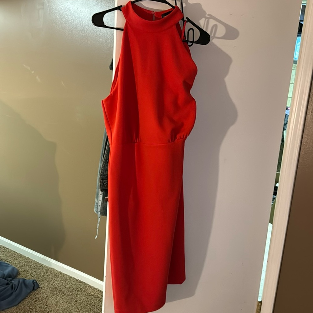 Red sleeveless halter dress.